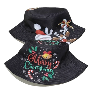 Detailed view of festive black Christmas bucket hats with reindeer and Santa Claus patterns
