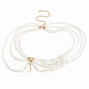 Chic multilayered pearl body chain with golden tassels and metal extensions