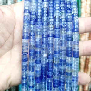 Close-up of blue natural stone spacer beads showing a smooth polished finish and round shapes