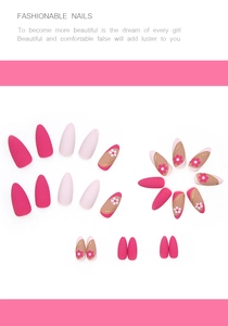 Matte almond press-on nails set with pink floral designs and gold wave patterns
