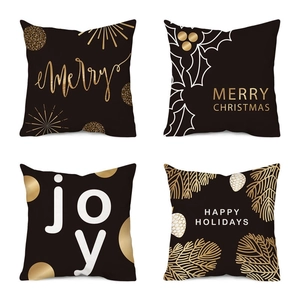 Set of four 18x18 inch Christmas pillow covers with black and gold holiday snowman prints