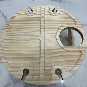 Macro top view of circular pine wood wine table with bottle holder and food compartments