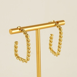 Boucles d'oreilles créoles torsadées en acier inoxydable plaqué or 18 carats