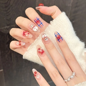 Christmas press-on nails with plaid patterns, 3D snowmen, and festive red berry wreaths