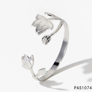 Detailed close-up of polished silver flower open bangle with white enamel lotus petals