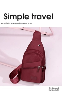Close-up of deep red oxford cloth chest bag featuring earphone port and front zip pockets