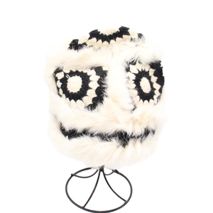 Detail view of winter crochet monster bucket hat with soft faux fur trim and ear protection