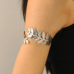 Close-up of silver leaf arm cuff featuring detailed leaf textures and adjustable design