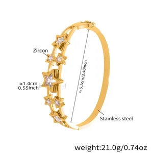 Detailed view of gold star bracelet with zirconia inlay and stainless steel specs