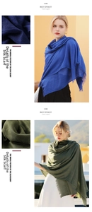 Detailed view of long crinkle cotton scarves with navy and olive colors and fringe edges