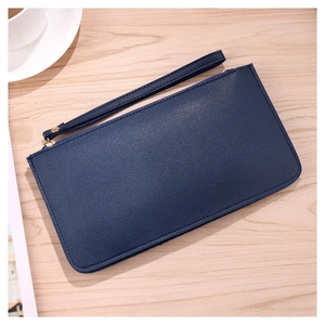 Dark blue long wallet in lychee grain PU leather with wristlet on wooden background