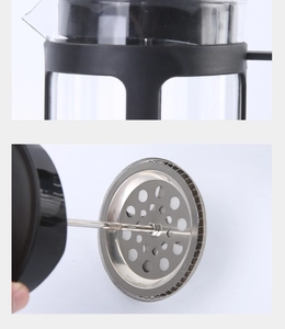 Detail view showing stainless steel mesh filter and heat-resistant glass coffee press