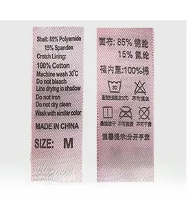 Detail view of care label showing 85% Polyamide, 15% Spandex and 100% Cotton lining