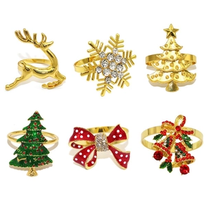 Set of 6 Christmas napkin rings featuring reindeer, snowflakes, and festive trees