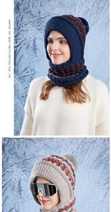Detail of knitted winter balaclava with fleece lining and fluffy faux fur pom-pom