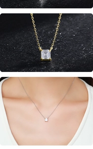 Detail view of square white gemstone pendant on gold and silver chain necklaces