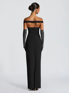 Detailed back view of a slim fit black strapless dress with a hidden zipper closure