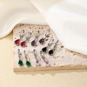 Elegant silver drop earrings with pear-cut gemstones in multiple colors on stone