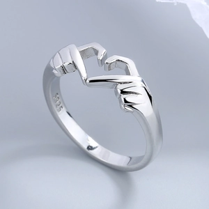Polished S925 sterling silver ring featuring a romantic heart gesture hand design