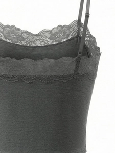 Detailed view of adjustable spaghetti straps and floral lace trim on dark grey bra