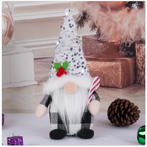 Detail of Christmas gnome with silver sequin hat, white beard and striped candy cane