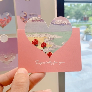 Close-up of pink heart-shaped card with oil painting texture and Especially For You text