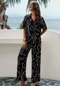 Women's summer two-piece set featuring black and white linear print shirt and wide-leg pants