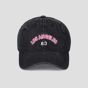 Detail of vintage Los Angeles 83 embroidery on washed denim baseball cap
