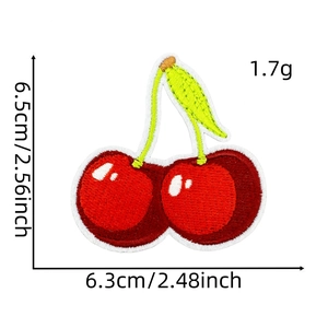 Detail of red cherry embroidery patch showing fabric texture and exact dimensions
