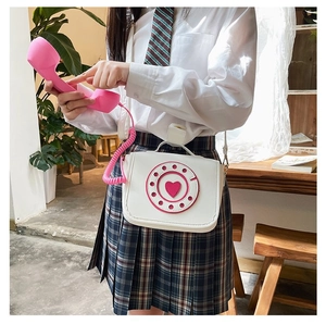 Creative white PU crossbody bag featuring unique pink telephone handset and heart design