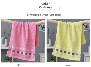 Close-up of pink and yellow cotton towels with checkered jacquard texture on a wood rack