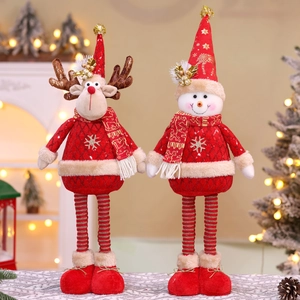 Detail of Christmas reindeer and snowman plush toys with sequins and festive embroidery