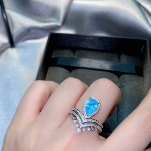 Luxury pear-cut aquamarine crown ring set with miniature pearls and V-shaped band