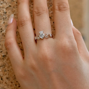 Macro detail of S925 sterling silver Claddagh ring with white zircon heart and crown