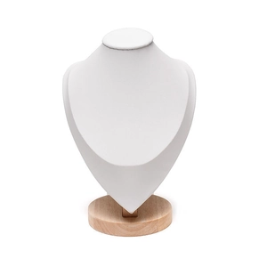 Detail of white bust necklace display with round wooden base and smooth leather texture