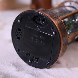 Detail of Christmas lantern base with three-way switch and battery compartment