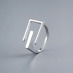 Detailed close-up showing S925 hallmark on minimalist silver hollow letter E ring