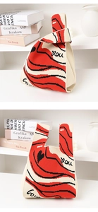 Detail of knitted tote bag with red lips pattern and love you text on white background