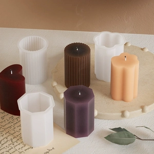 Silicone candle molds in geometric shapes like cylinders and prisms for DIY candle making