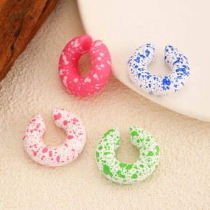 Y2K style colorful C-shaped ear cuffs with paint splatter texture on matte finish