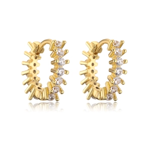 Macro shot of gold-plated hoop earrings with micro-set zircon and spiked metal details