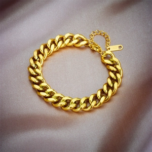 Detailed close-up of 18KGP gold plated Cuban link bracelet on premium silk background