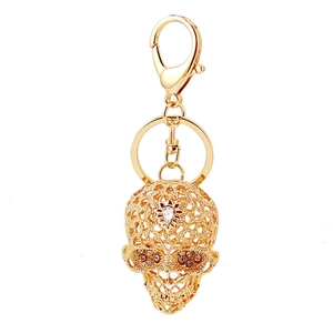 Crystal skull keychain in gold alloy with rhinestone eyes and lobster clasp ring
