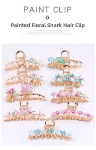 Detailed overhead view of multiple alloy flower hair claws with enamel and pearls
