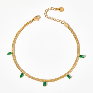 Gold flat snake chain anklet with green rectangular zircon stones and lobster clasp