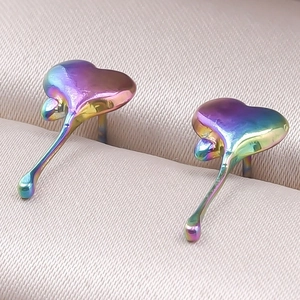 Macro detail of iridescent heart-shaped liquid drop earrings in high-quality 304 stainless steel
