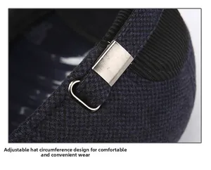 Close-up of adjustable metal buckle and elastic strap on winter baseball cap fabric