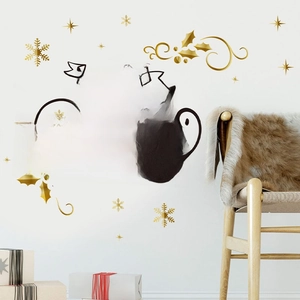 Détail d'autocollants muraux Merry Christmas avec lettrage noir et flocons dorés