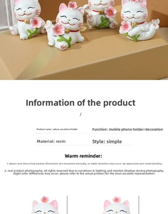 Macro detail of cherry blossom lucky cat resin phone holder with minimalist floral design