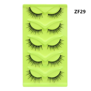 Detail view of 5 pairs of black fox-eye cat-eye false eyelashes in a green tray, style ZF29